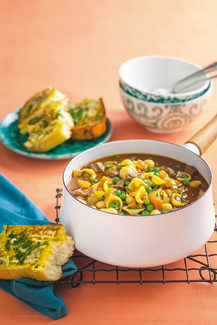 Beef soup with noodles and herb-cheese baguette