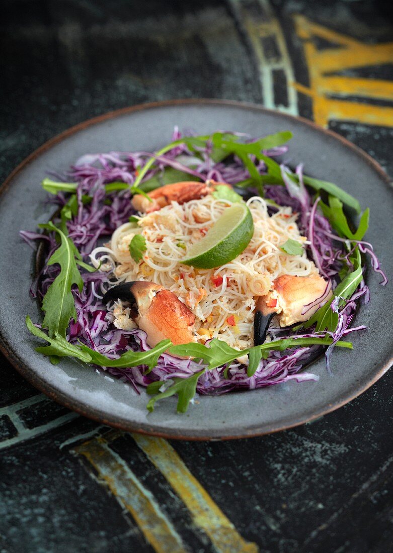 Crab salad with rice noodles on julienned red cabbage