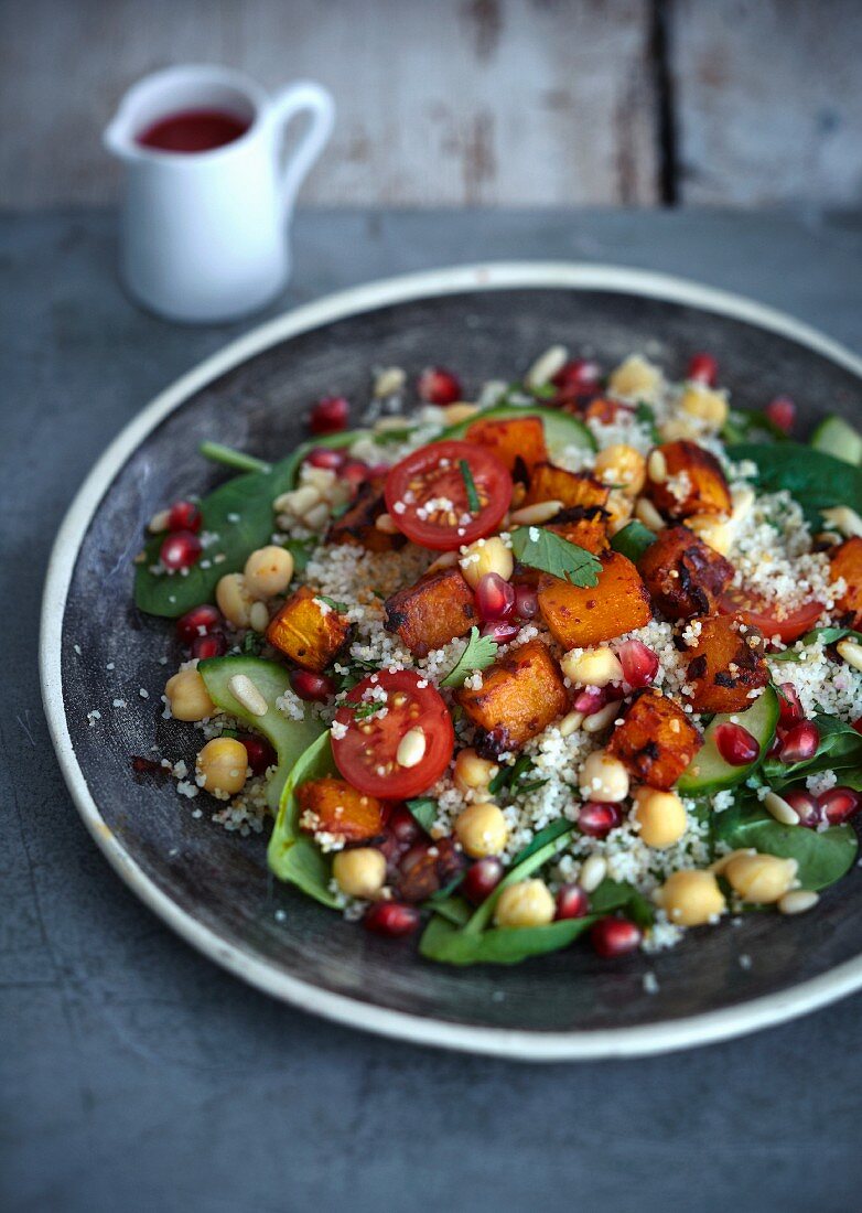 Couscous salad with roast sweet potatoes and pomegranate seeds