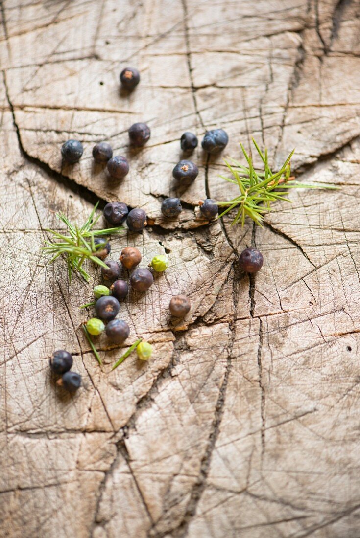 Juniper berries on a wooden surface