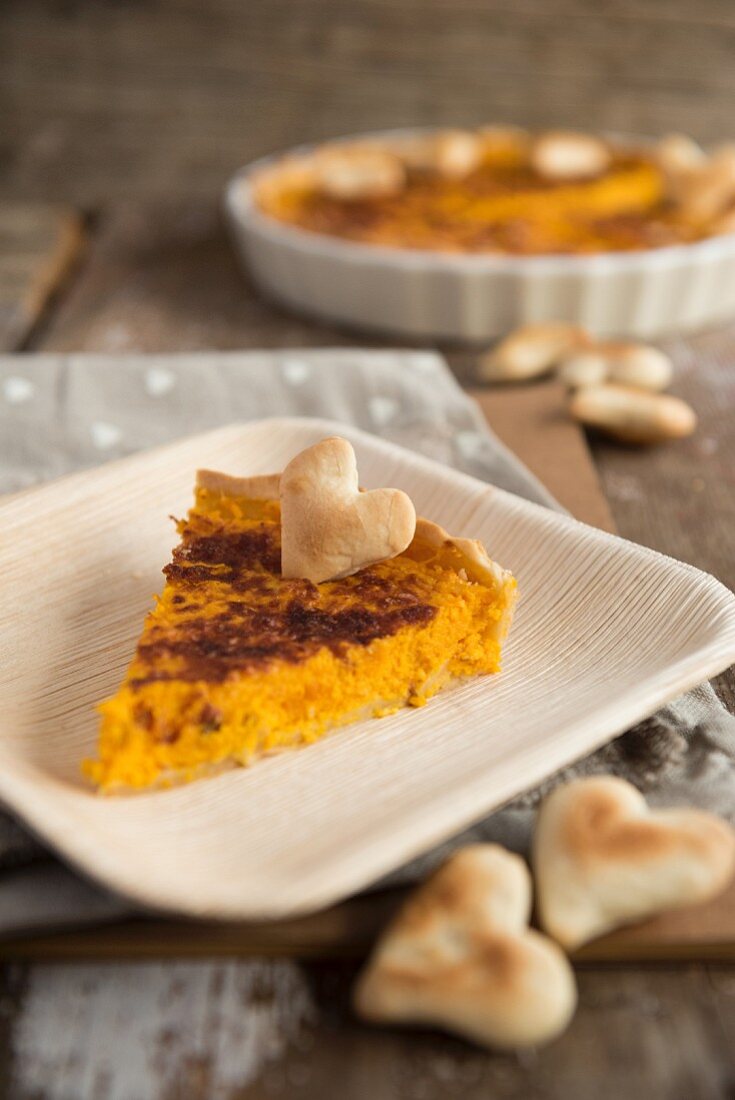 Rustic pumpkin tart decorated with pastry hearts