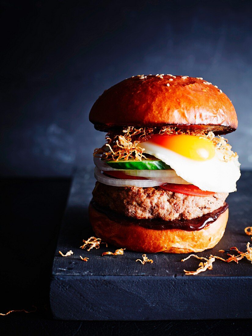 A classic burger with a fried egg, close-up