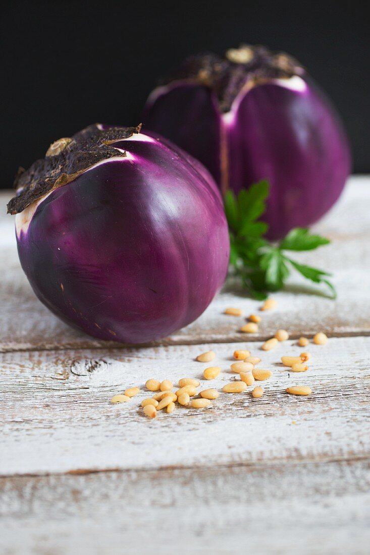 Two Round Eggplants on White Background