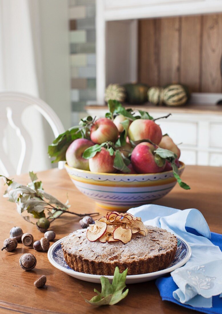 Apple and almond cake on an autumnal dining table