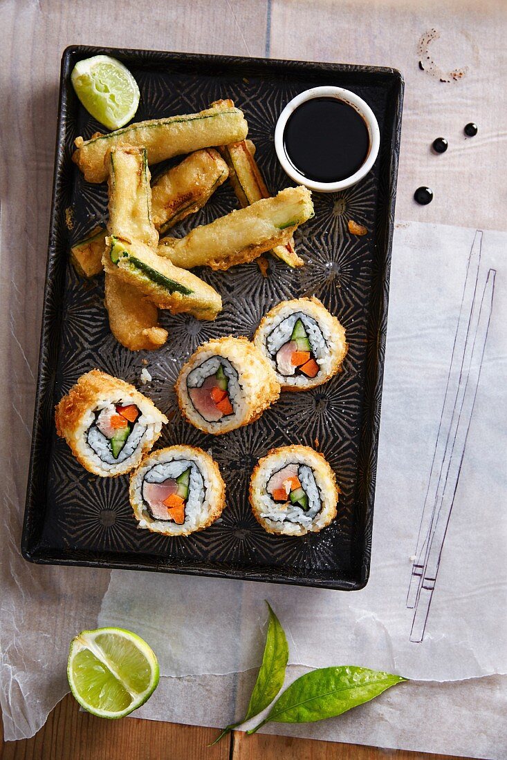 Fried tuna fish sushi rolls with marrow squash in tempura batter