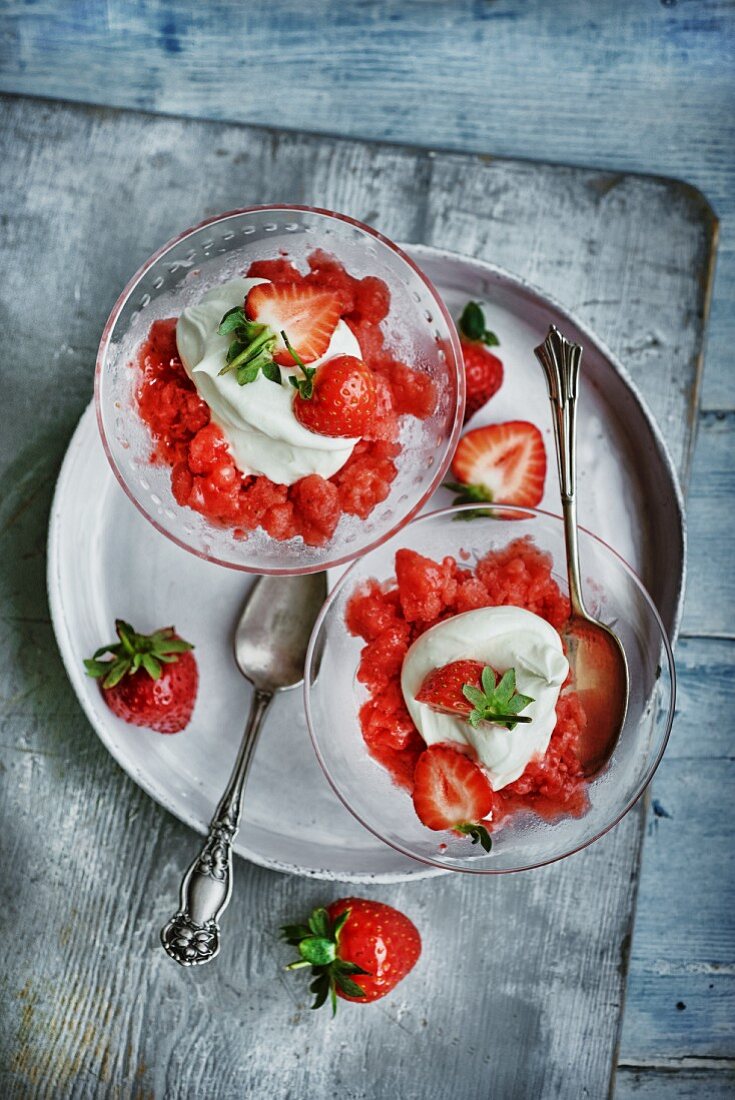 Strawberry granita with whipped cream and fresh strawberries