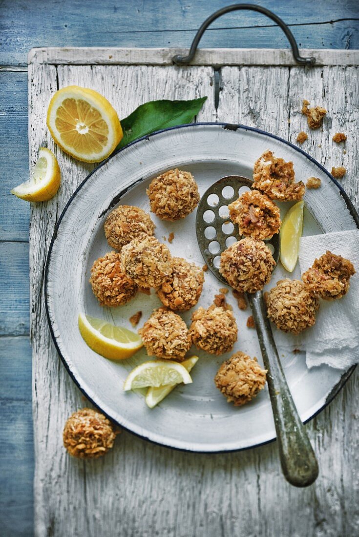 Fried lamb meatballs with lemons