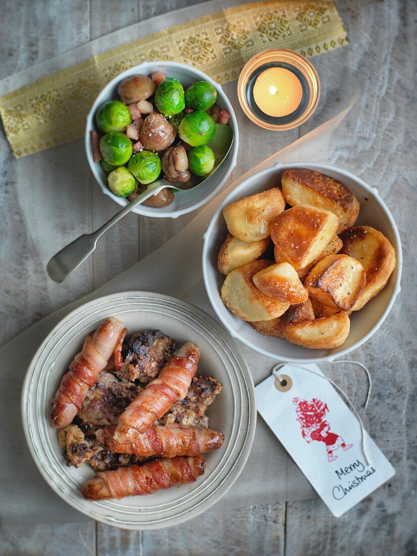 Sausages in bacon, a Brussels sprouts and chestnut medley and roast potatoes