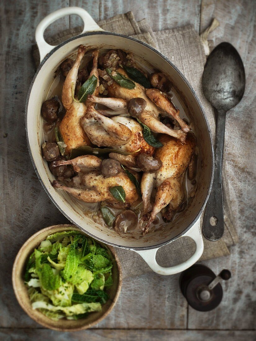 Braised quails with mushrooms served with a savoy cabbage medley
