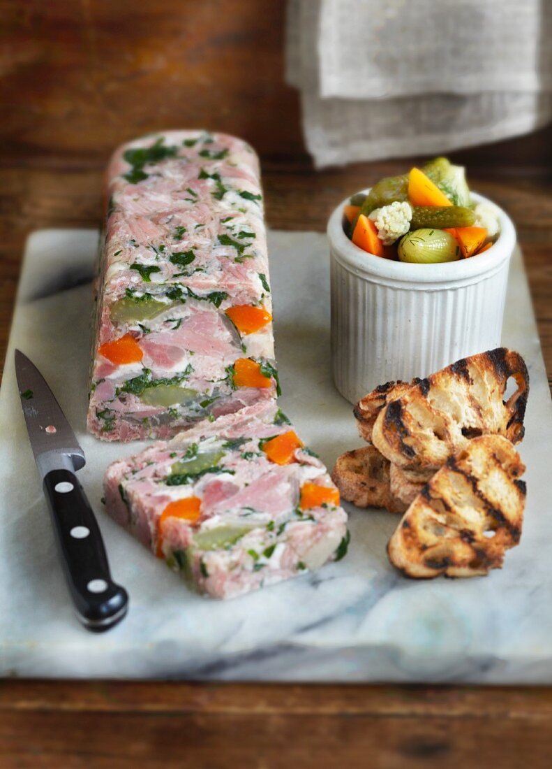 Pork knuckle terrine with gherkins and grilled bread