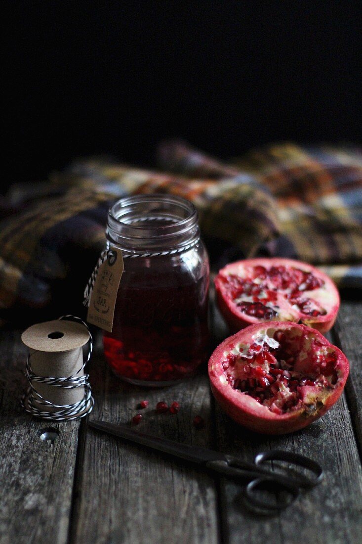 Pomegranate jelly and a halved pomegranate