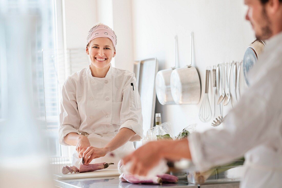 Two chefs working in a commercial kitchen