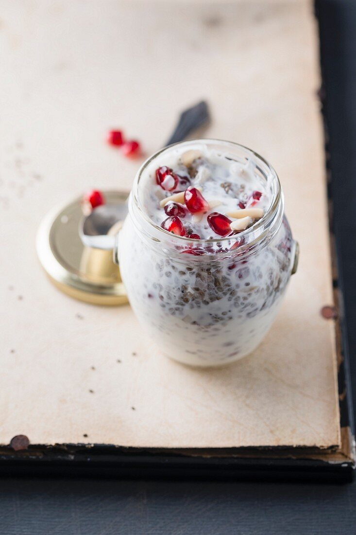 Yoghurt with chia seeds, pomegranate seeds and fruit muesli