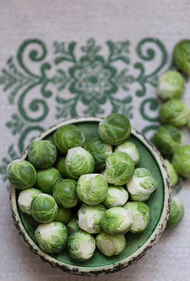 Brussels sprouts on an embroidered tablecloth