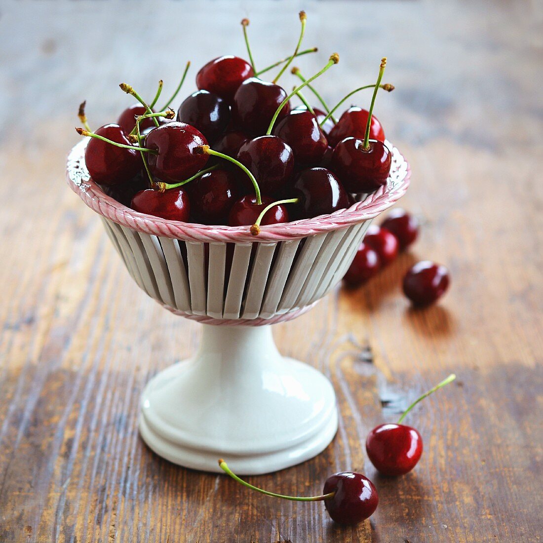 Cherries in a ceramic goblet