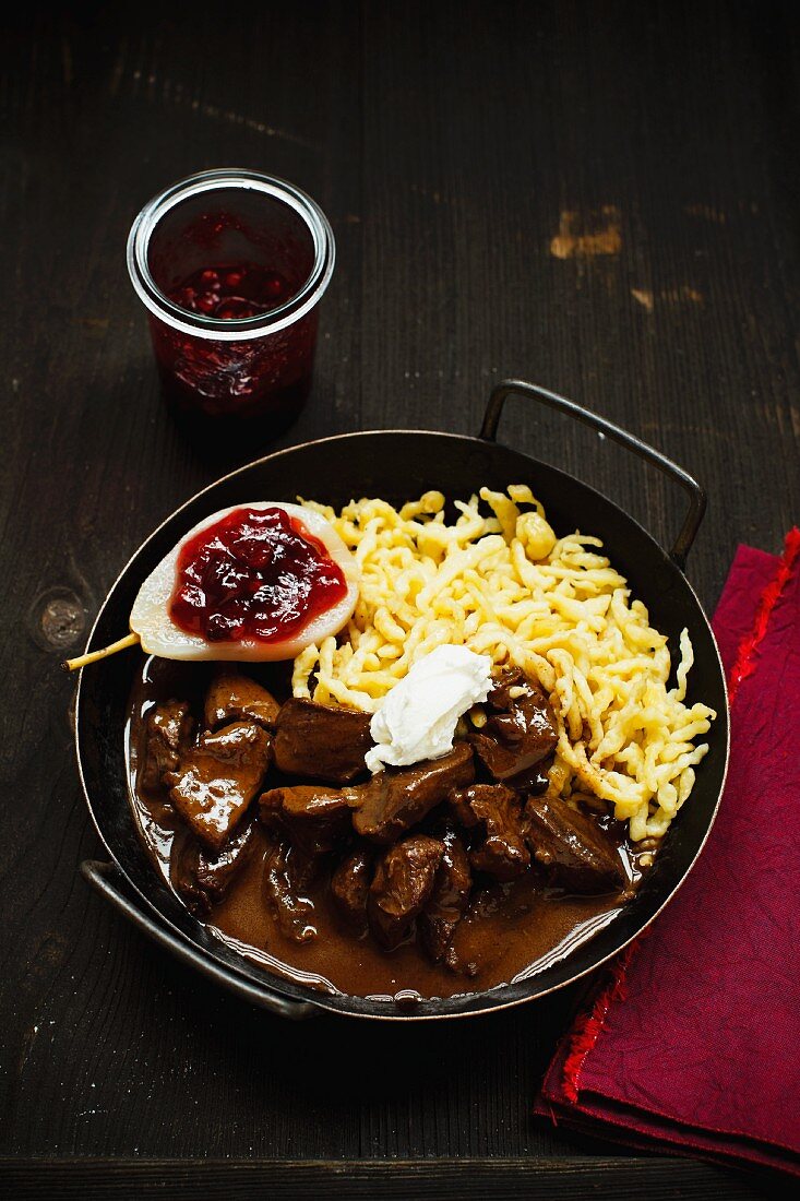Venison ragout with Spätzle (soft egg noodles from Swabia) and a lingonberry pear