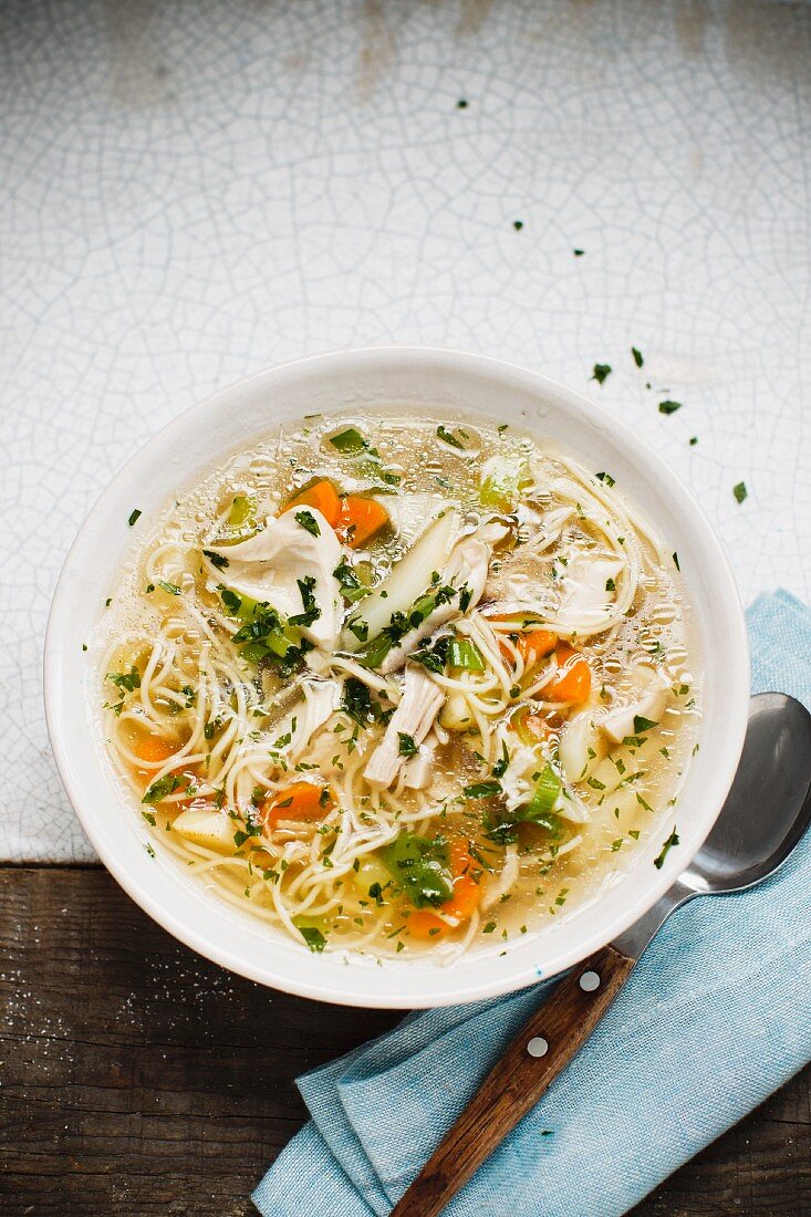 Chicken Noodle Soup in a Glass Bowl