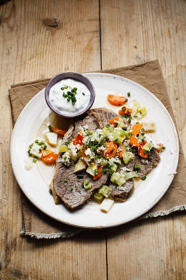 Prime boiled beef with vegetables and chive sour cream