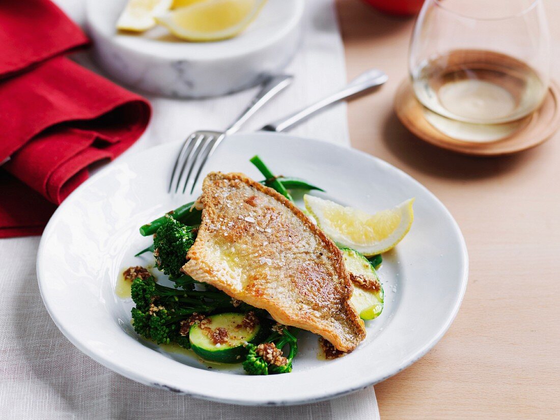 Crispy fish with warm greens