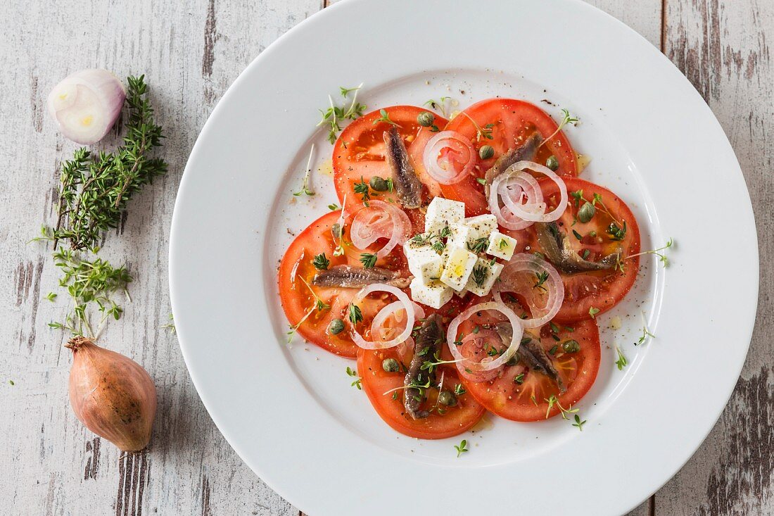 Tomato salad with anchovies and feta cheese