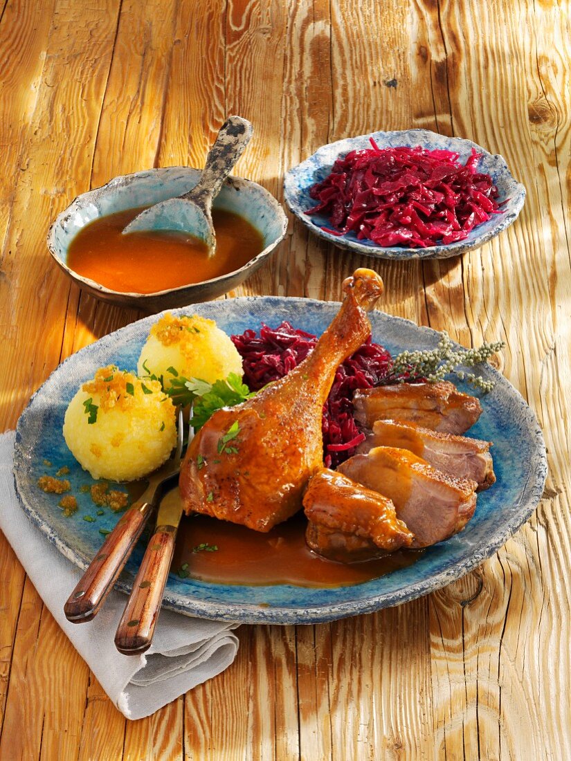 Roast goose with red cabbage and potato dumplings