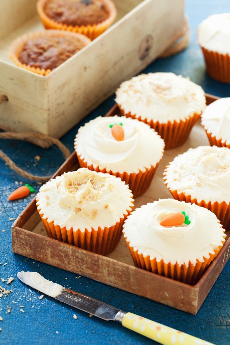 Spelt and carrot cupcakes decorated with sugar carrots