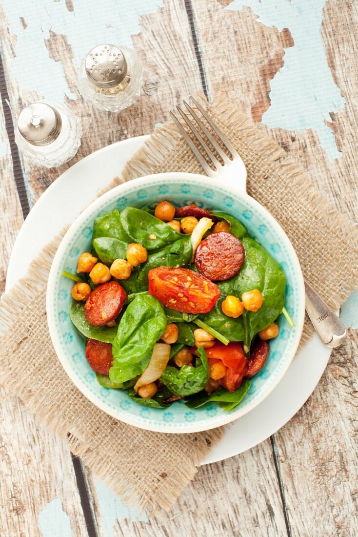 Spinach salad with spicy roasted chickpeas and chorizo
