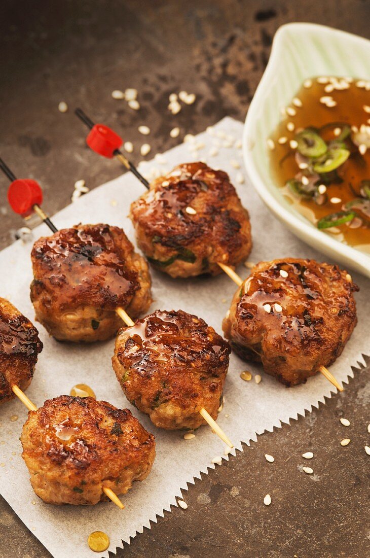 Chicken meatballs on sticks with sesame seeds (Japan)