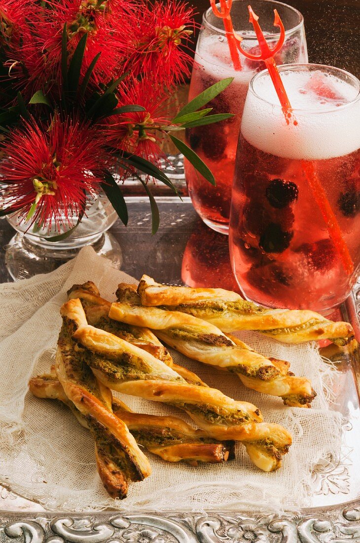 Cheese sticks with pesto and two berry cocktails