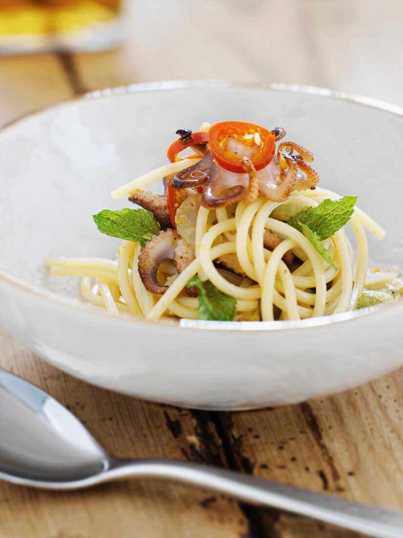 Spaghetti with fried mini octopus and tomatoes
