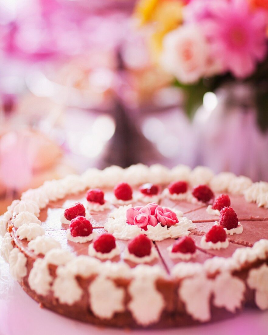 Summer raspberry cake decorated with cream