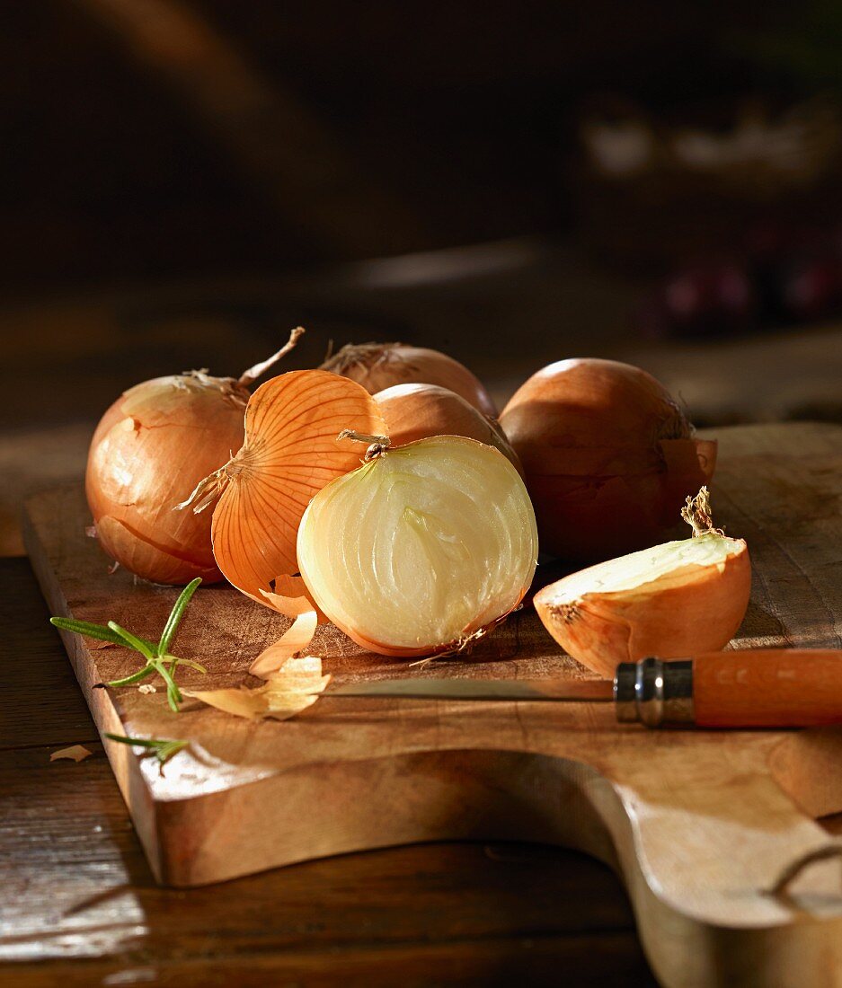 Onions on a wooden chopping board