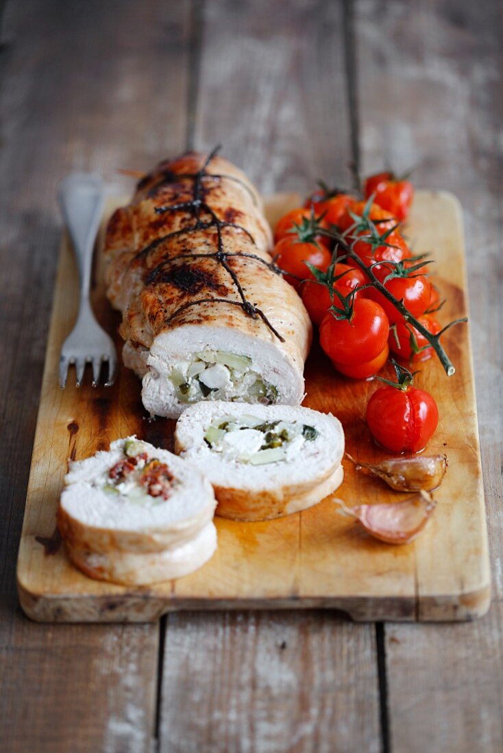 Turkey breast roulade stuffed with courgette, feta cheese and dried tomatoes