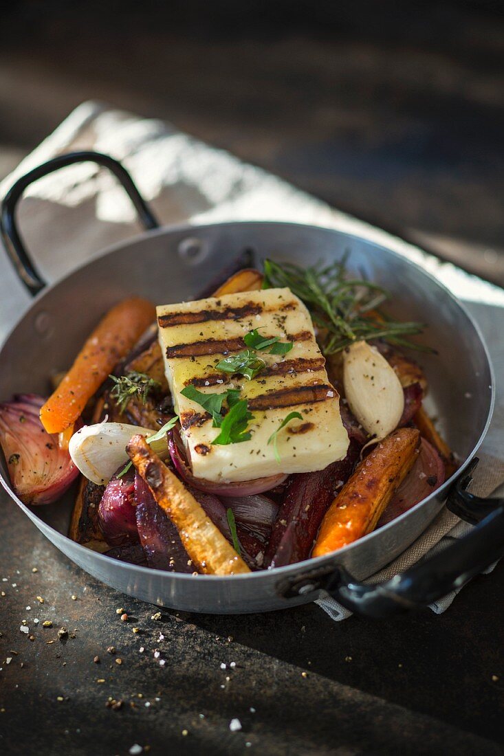 Grilled halloumi on oven-roasted vegetables