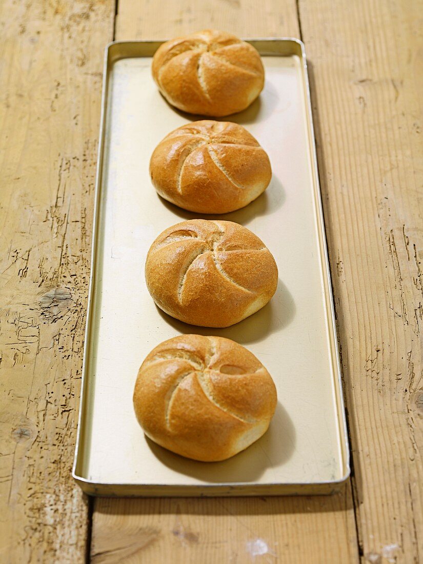 Four fresh bread rolls