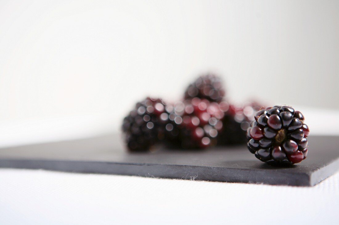 Blackberries on a grey board