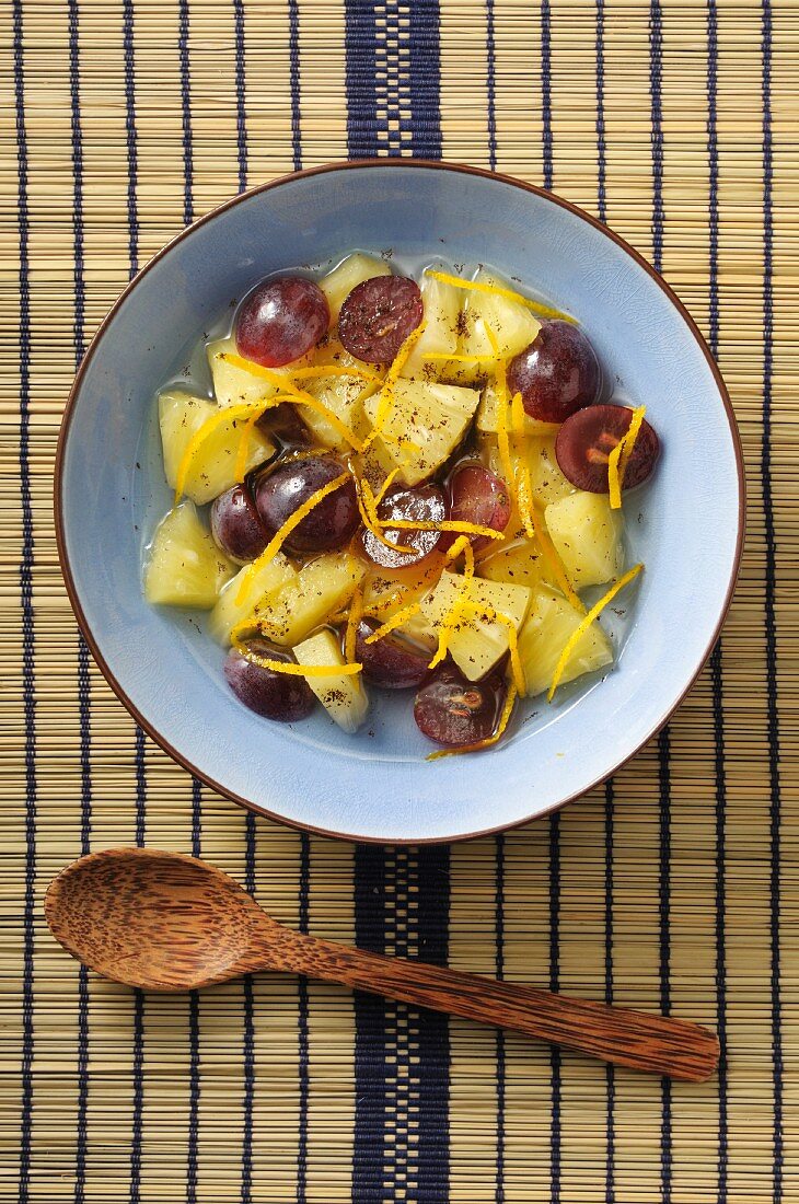 Pineapple salad with grapes and oranges