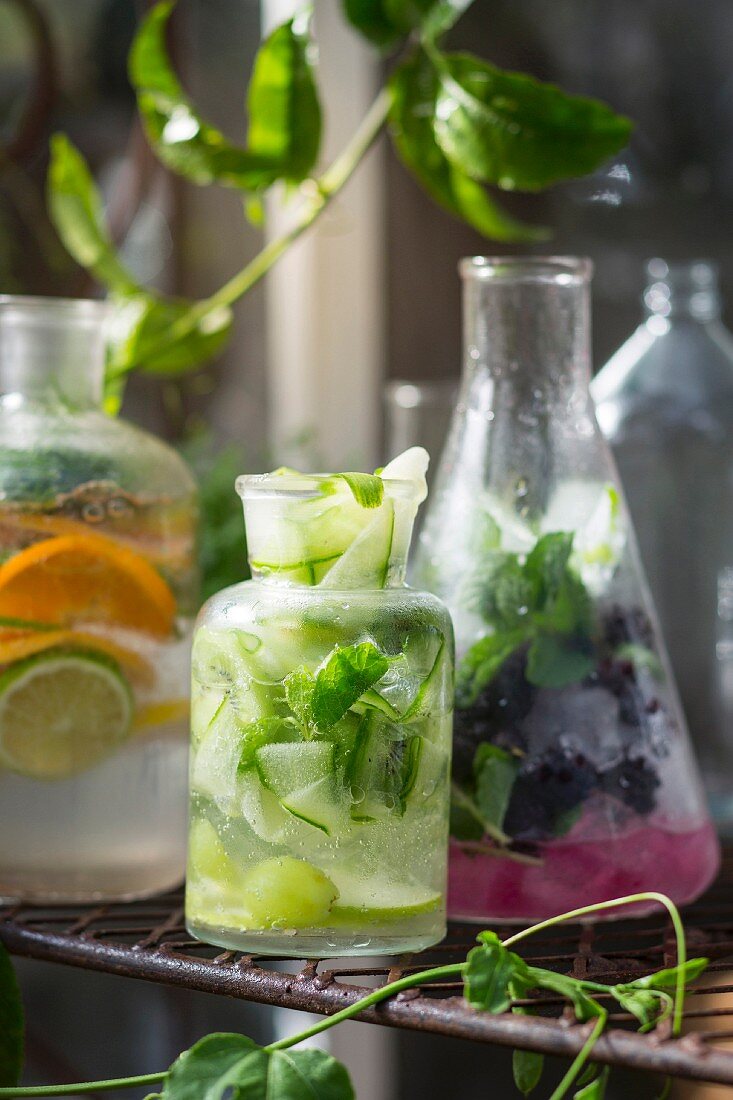 Various summer drinks with fruit, vegetables and herbs