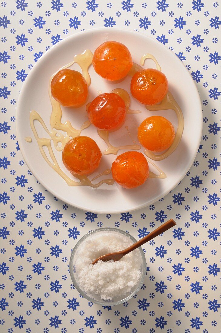 Candied clementines on a plate seen from above