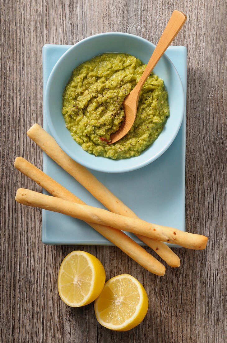 Guacamole, grissini and lemons