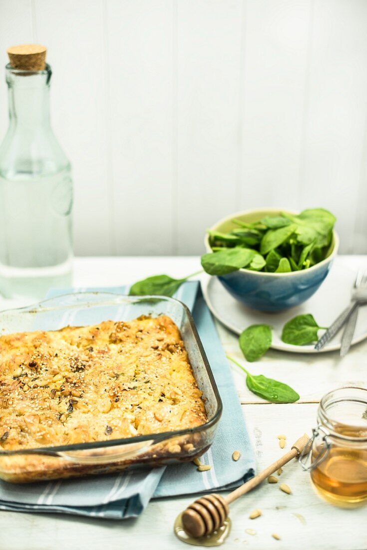 Spinach gratin with pine nuts and honey