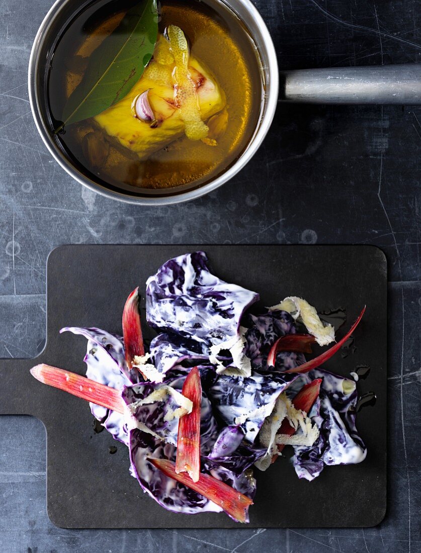 Red cabbage in a creamy sauce with rhubarb served with poached hake