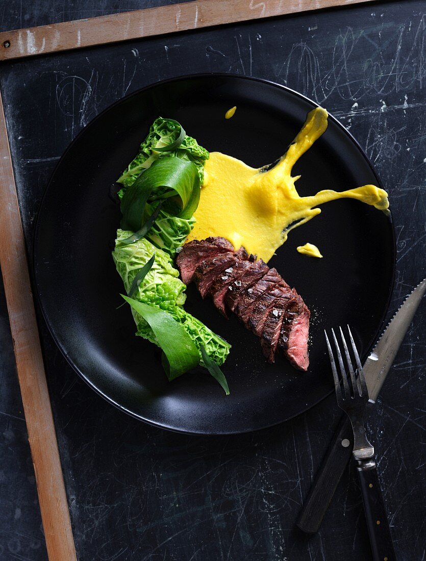 Beef with steamed savoy cabbage and sauce Bearnaise