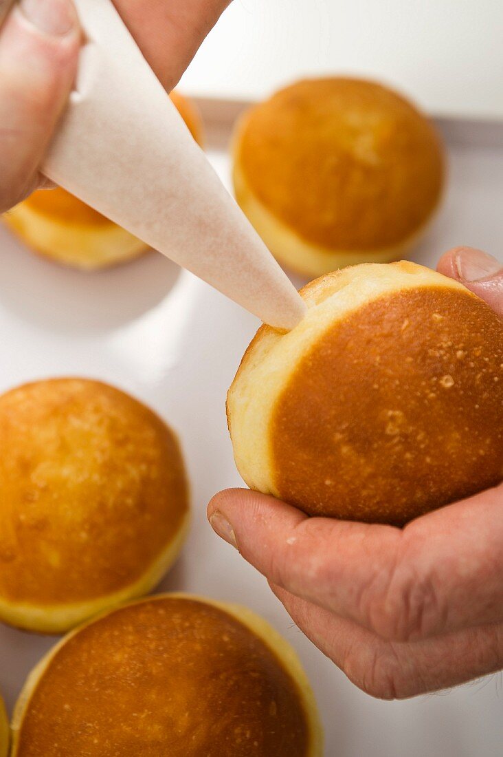 Doughnuts being filled