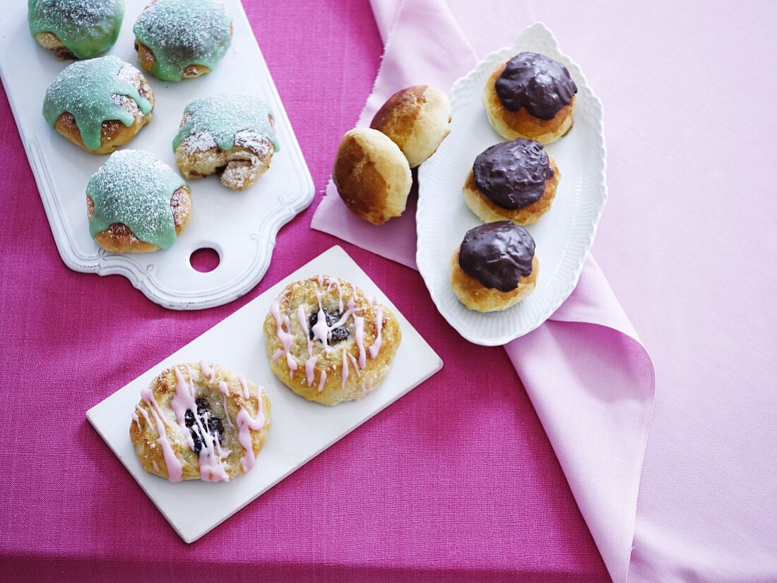 Various sweet pastries with icing and chocolate glaze