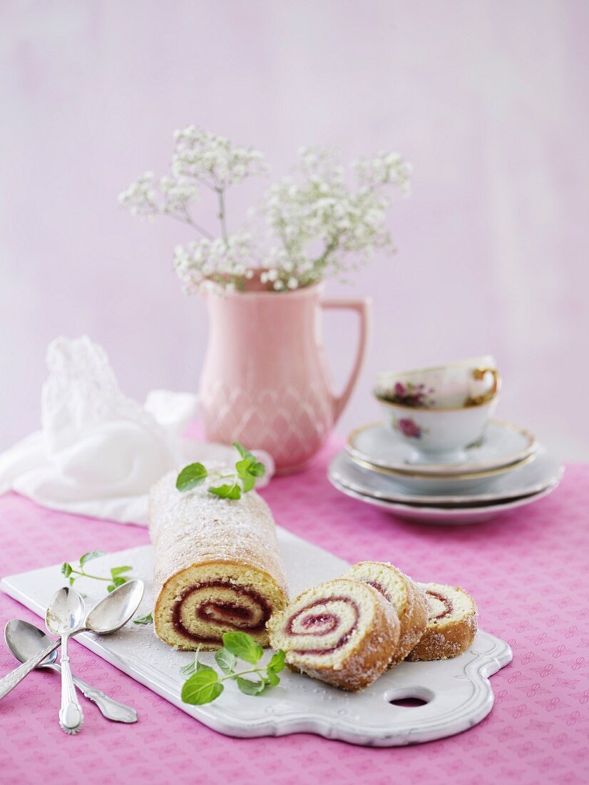 Slices of Swiss roll with berry jam