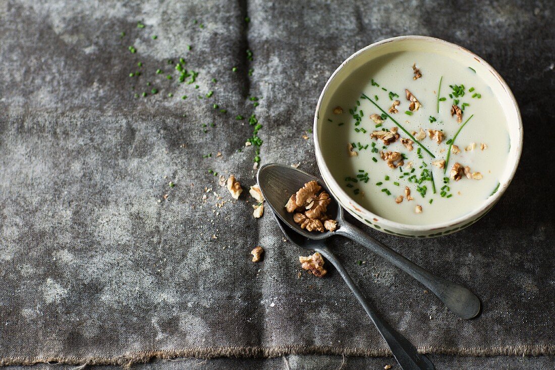 Celeriac soup with walnuts and chives