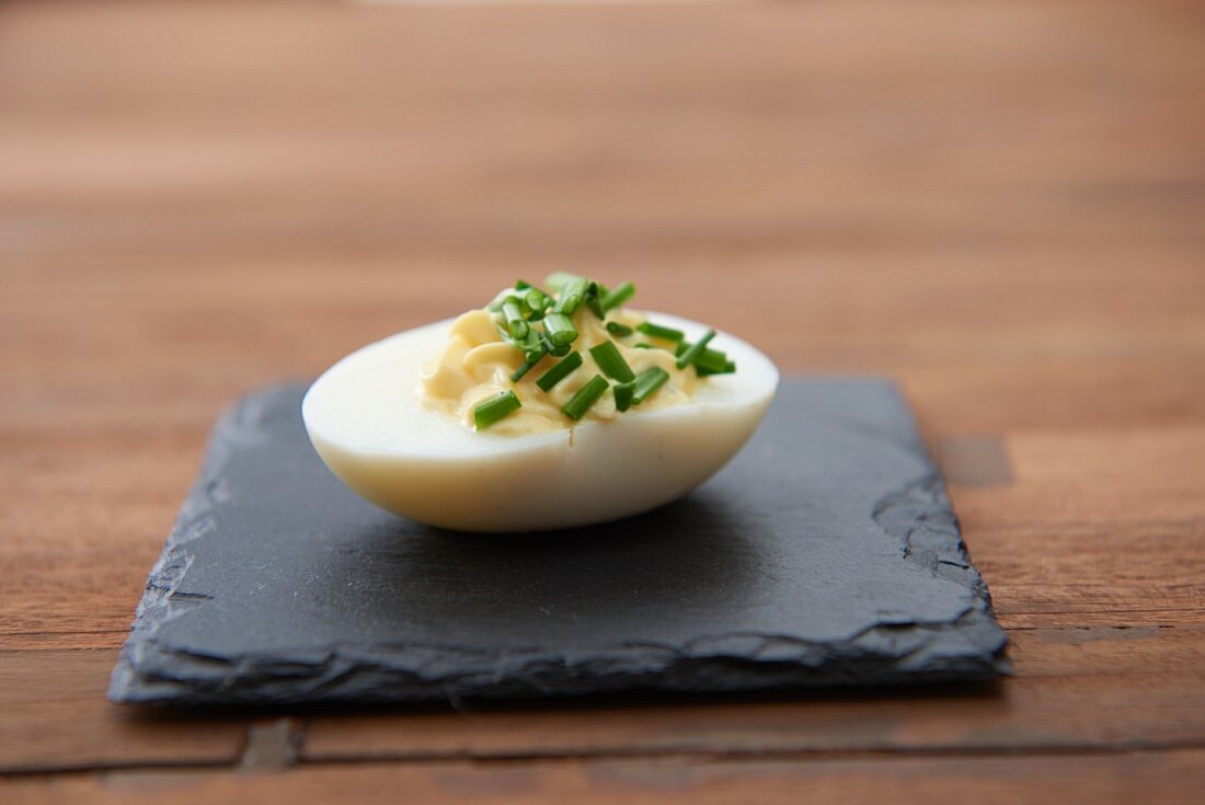 A devilled egg with chives