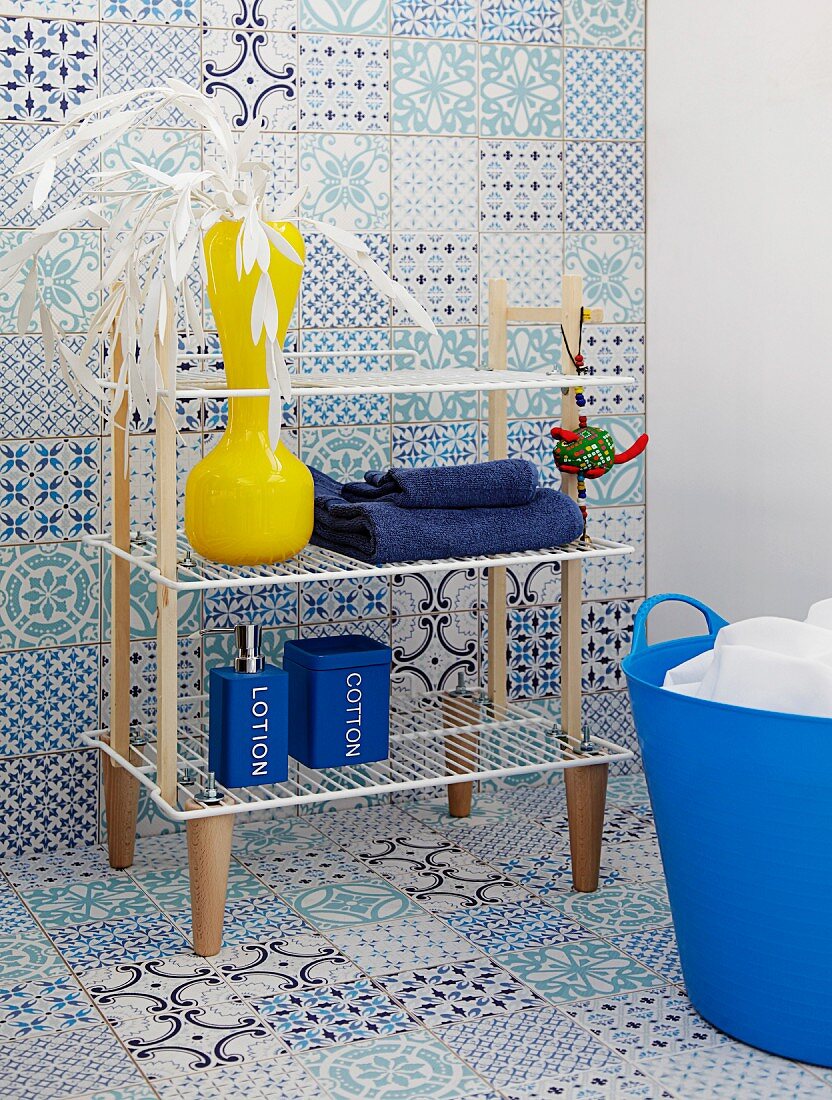 DIY bathroom shelves made from wooden slats and cabinet legs