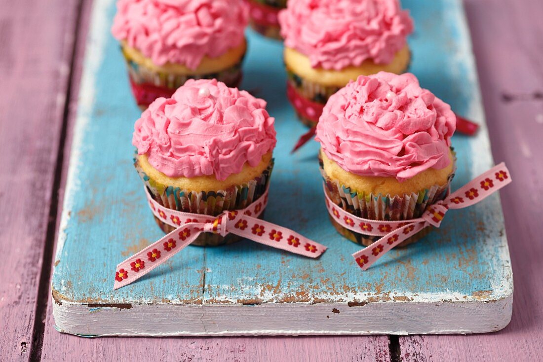 Vanilla cupcake with a pink mascarpone cream topping